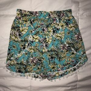 Floral silky shorts with Pom Pom hem detail